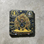 Black Mahakala black slate art tile, front view of the printed artwork and natural slate edges.