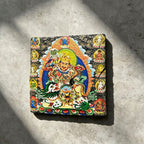 Vaishravana on snow lion black slate art tile, front view of the printed artwork and natural slate edges.