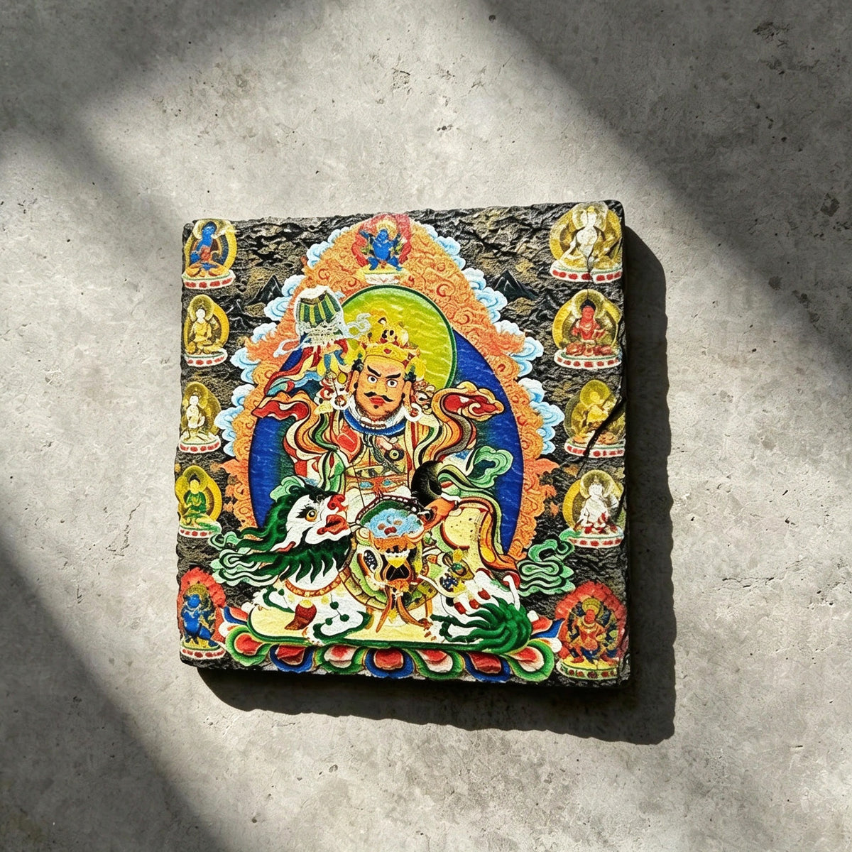 Vaishravana on snow lion black slate art tile, front view of the printed artwork and natural slate edges.