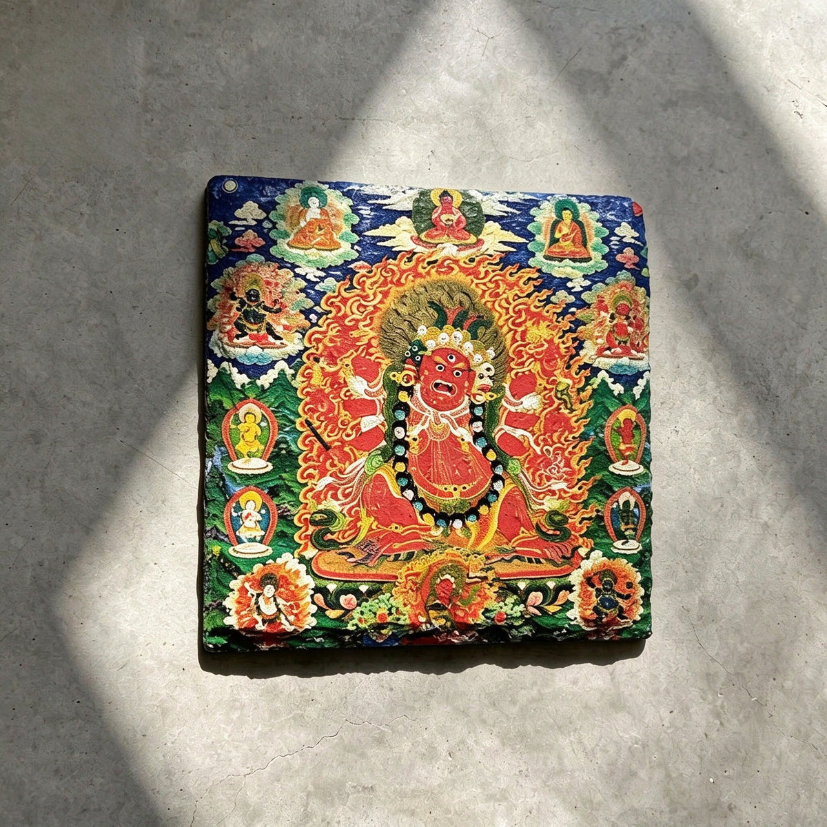 Red Jambhala black slate art tile, front view of the printed artwork and natural slate edges.