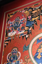 Upper-left detail of the Mahakala thangka and painted border