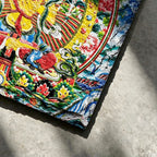 Yellow Manjushri black slate art tile, close-up of the printed details, surface texture and slate edge.