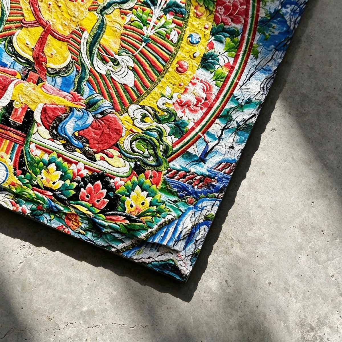Yellow Manjushri black slate art tile, close-up of the printed details, surface texture and slate edge.