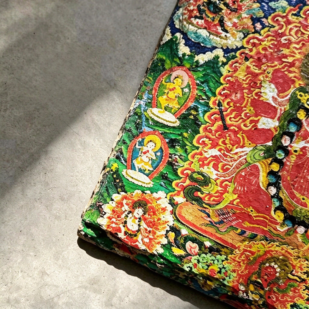 Red Jambhala black slate art tile, close-up of the printed details, surface texture and slate edge.