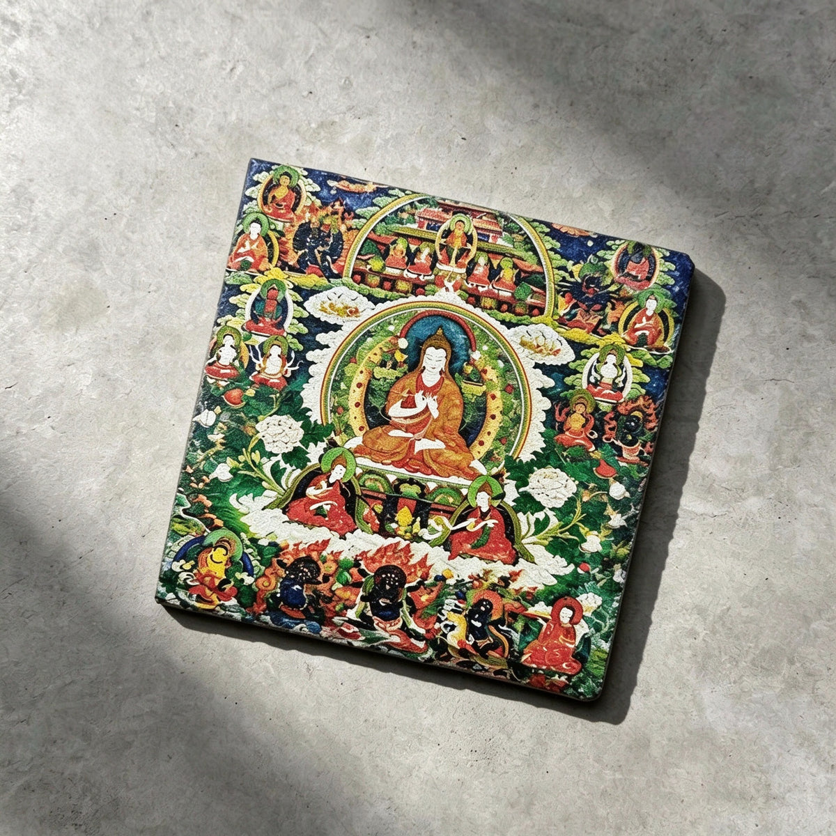 Tibetan Buddhist lineage masters black slate art tile, angled view showing the printed face and slate thickness.