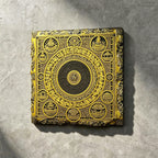 Tibetan Buddhist mandala black slate art tile, front view of the printed artwork and natural slate edges.