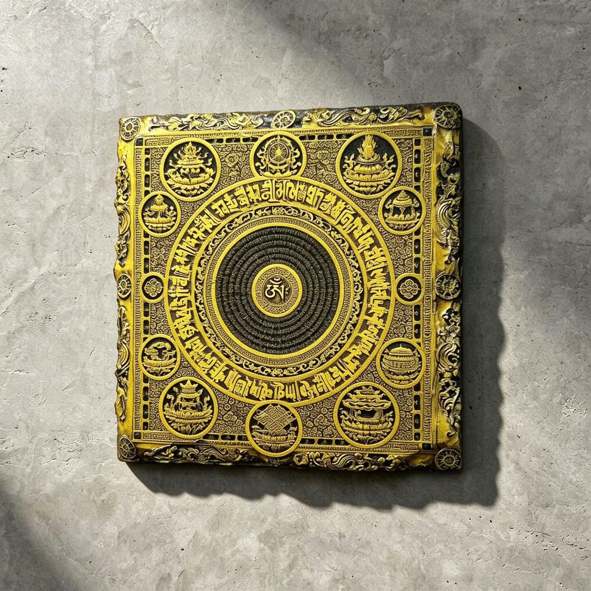 Tibetan Buddhist mandala black slate art tile, front view of the printed artwork and natural slate edges.