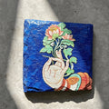 Lotus and hand black slate art tile, front view of the printed artwork and natural slate edges.