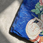 Lotus and hand black slate art tile, close-up of the printed details, surface texture and slate edge.