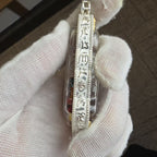 Side profile of the Zaki Lhamo case with decorative script