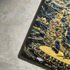 Black Mahakala black slate art tile, close-up of the printed details, surface texture and slate edge.