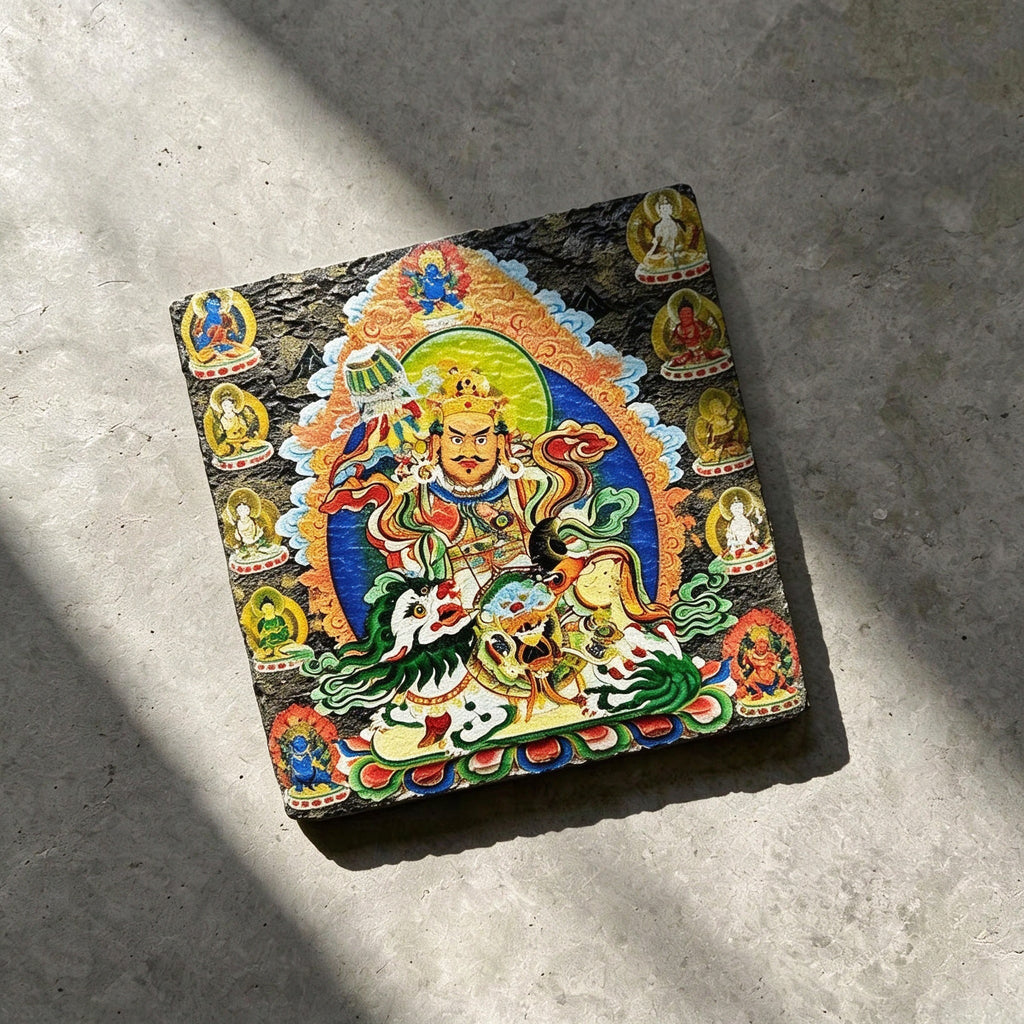 Vaishravana on snow lion black slate art tile, angled view showing the printed face and slate thickness.