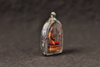 Angled view showing the depth of the Jowo Rinpoche pendant case