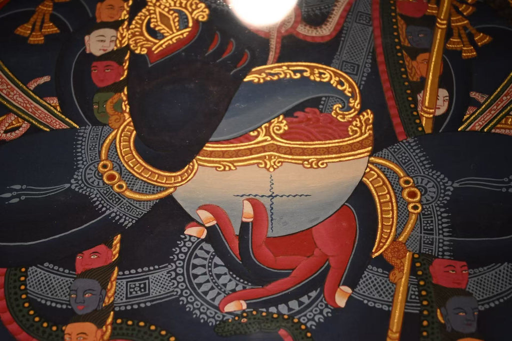 Close-up of Mahakala's hand and bowl in the red-ground painting