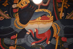 Close-up of Mahakala's hand and bowl in the red-ground painting