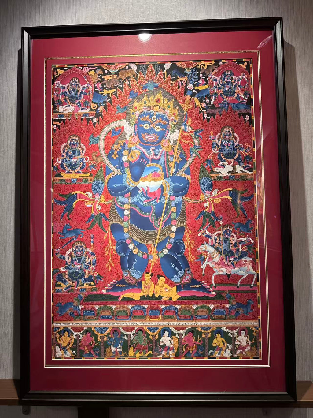 Full framed Mahakala thangka showing the central and surrounding figures