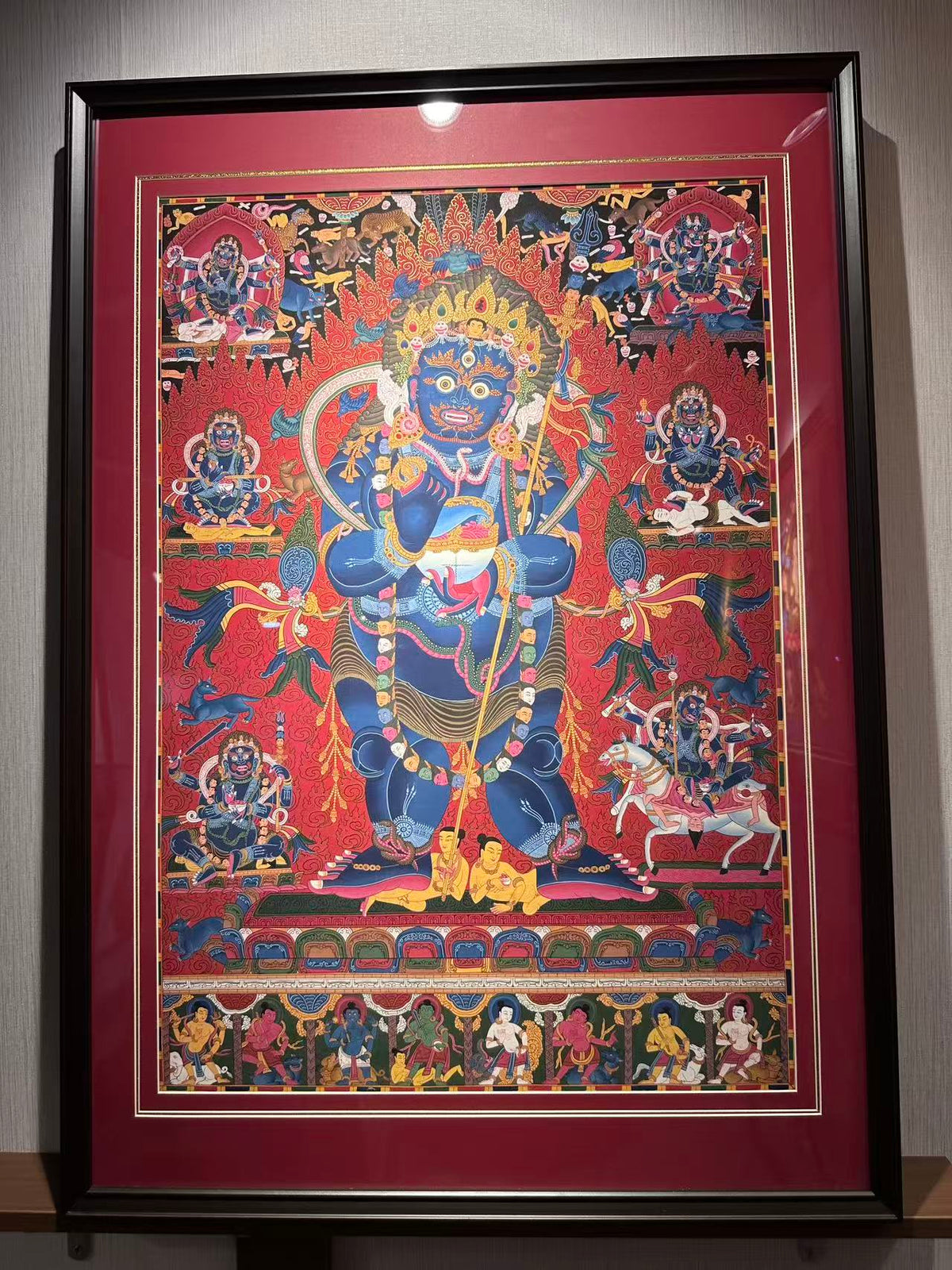 Full framed Mahakala thangka showing the central and surrounding figures