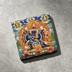 Yamantaka black slate art tile, angled view showing the printed face and slate thickness.