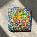 Yellow Manjushri black slate art tile, front view of the printed artwork and natural slate edges.