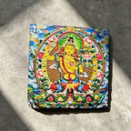 Yellow Manjushri black slate art tile, front view of the printed artwork and natural slate edges.