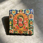 Red Jambhala black slate art tile, front view of the printed artwork and natural slate edges.