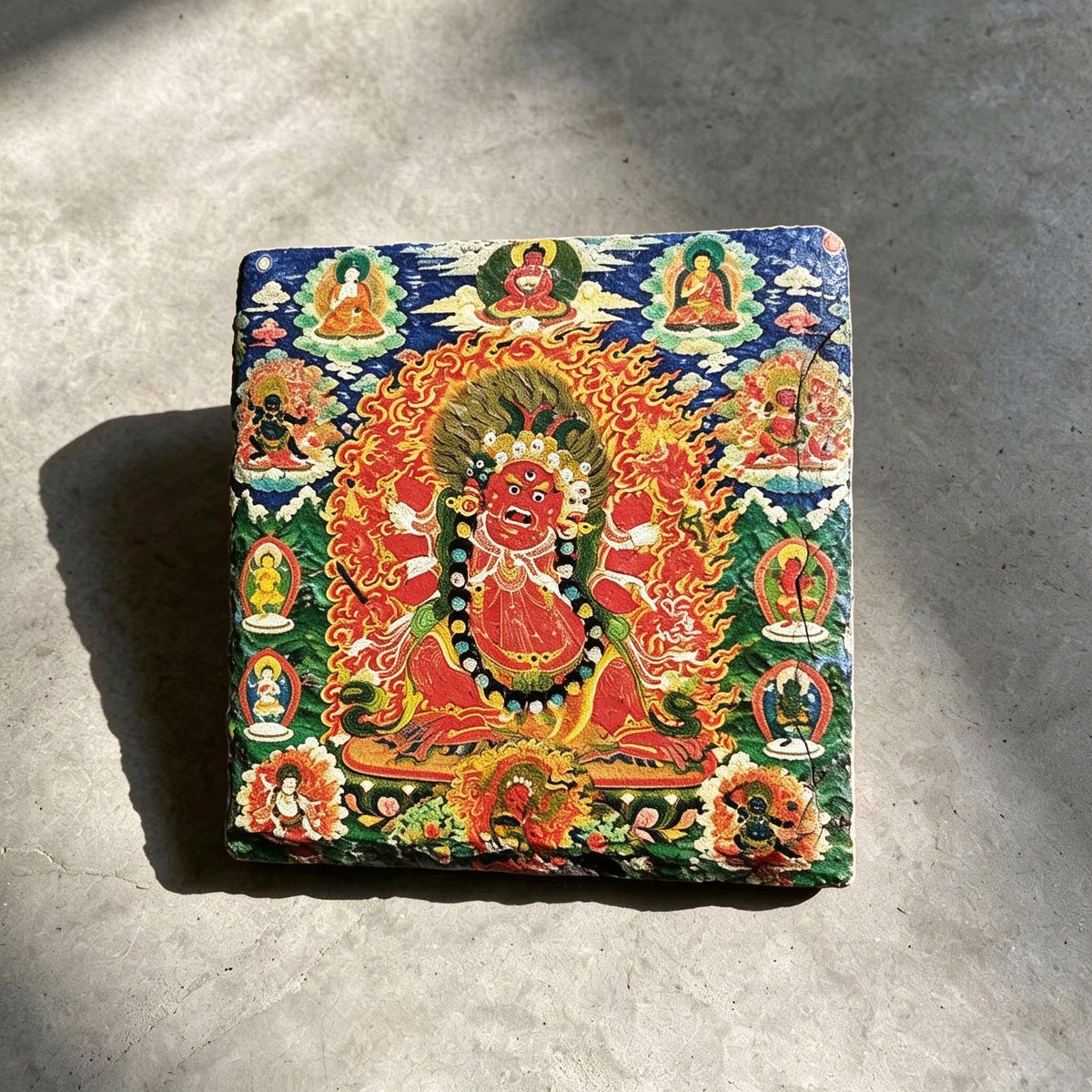 Red Jambhala black slate art tile, front view of the printed artwork and natural slate edges.