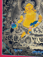Yellow Jambhala thangka showing the lotus and lower landscape