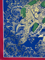 Hand, draped robes and left-side flowers — Blue-and-gold Green Tara thangka