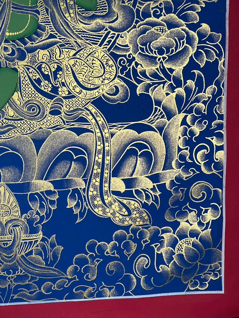 Lower-right lotus and floral detail — Blue-and-gold Green Tara thangka