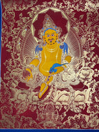 Full red composition with yellow figure and pale floral linework — Red-ground Yellow Jambhala thangka