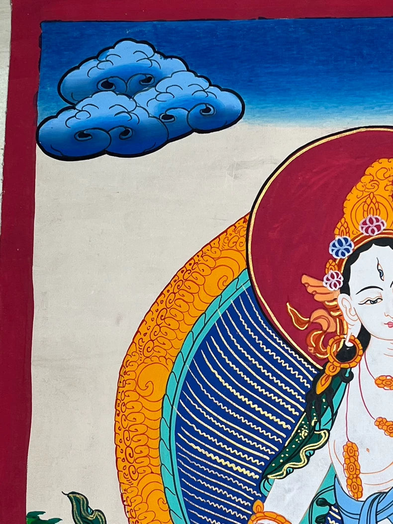 Upper-left cloud beside the red halo — White Tara landscape thangka