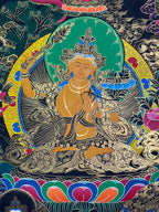 Orange figure, crown and raised sword — Manjushri sword-and-lotus thangka