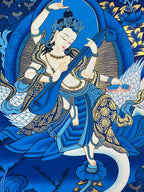 Figure playing a stringed instrument above the swan — Blue landscape Saraswati thangka