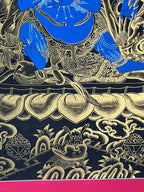 Mahakala's lower robes and lotus petals in fine painted linework