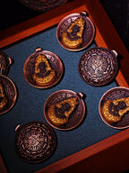 Front and patterned reverse views of Jowo Rinpoche pendants