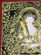 Upper-left flowers and central halo — Black-and-gold Akashagarbha thangka