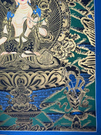 Lower-right landscape and small blue figure — Black-and-gold White Tara thangka