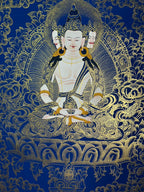 Seated figure with crown and gold floral halo — Blue-and-gold Mahavairocana thangka
