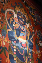 Angled detail of the central Mahakala figure and flaming halo