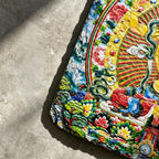 Yellow Manjushri black slate art tile, close-up of the printed details, surface texture and slate edge.