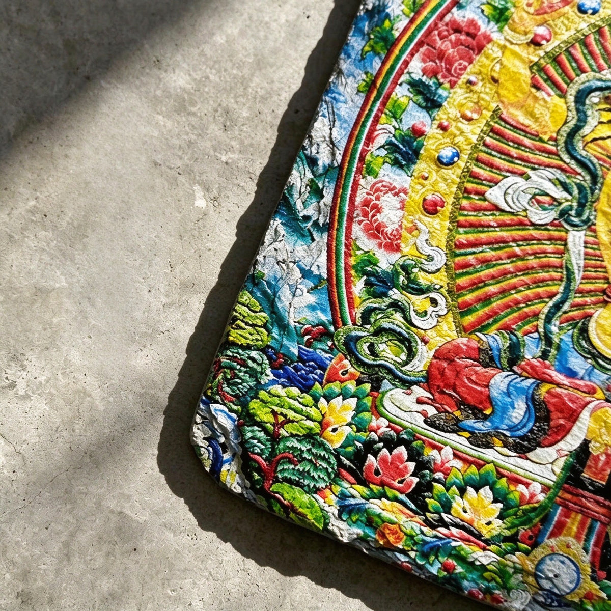 Yellow Manjushri black slate art tile, close-up of the printed details, surface texture and slate edge.