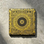 Tibetan Buddhist mandala black slate art tile, front view of the printed artwork and natural slate edges.