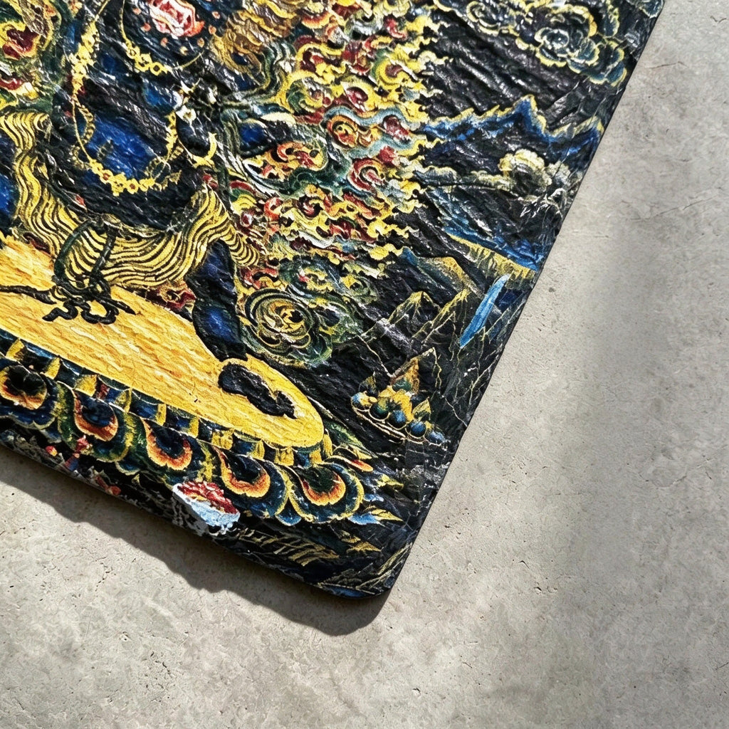 Black Mahakala black slate art tile, close-up of the printed details, surface texture and slate edge.