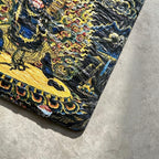 Black Mahakala black slate art tile, close-up of the printed details, surface texture and slate edge.