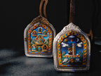 Five Jambhalas pendant shown alongside its Tenfold Powerful Symbol reverse