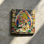 Vaishravana on snow lion black slate art tile, angled view showing the printed face and slate thickness.