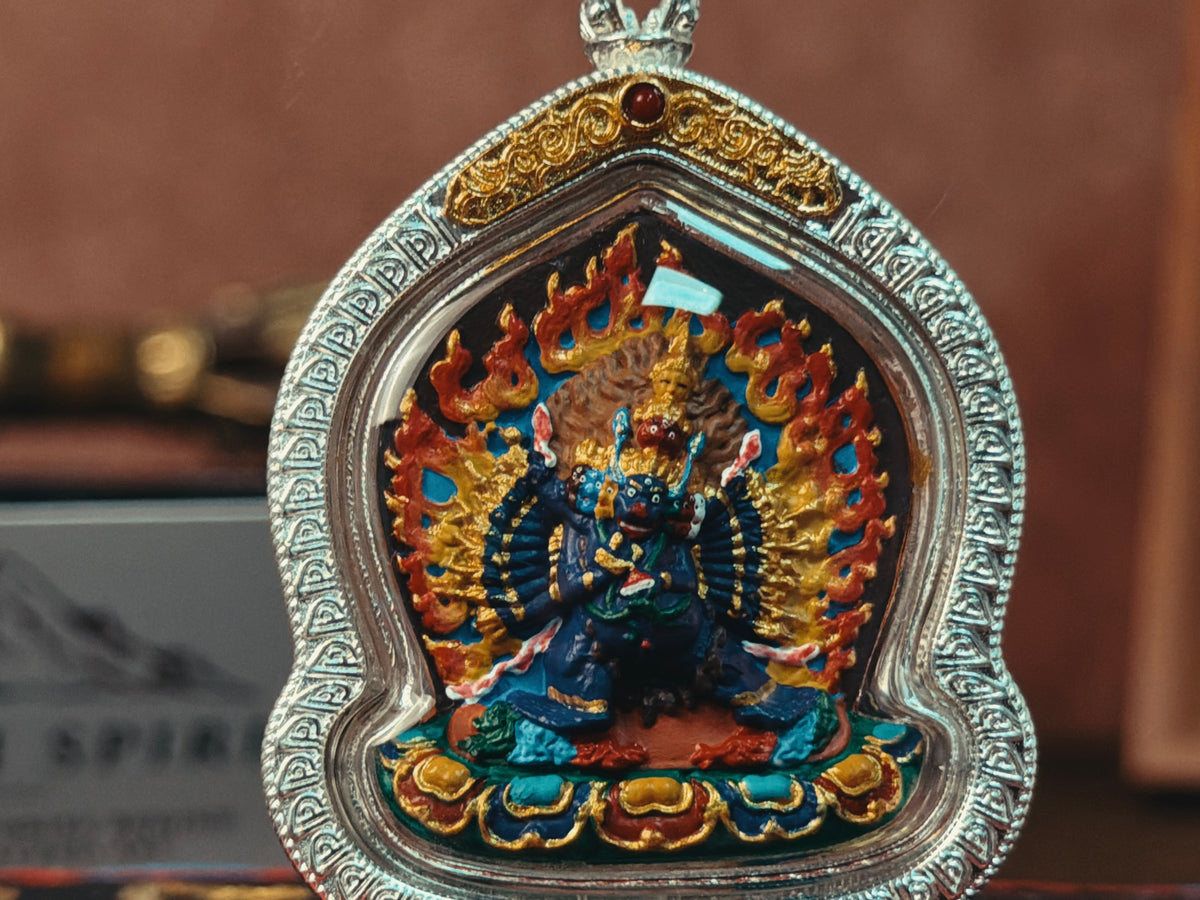 Front view of Yamantaka pendant showing the complete relief and case