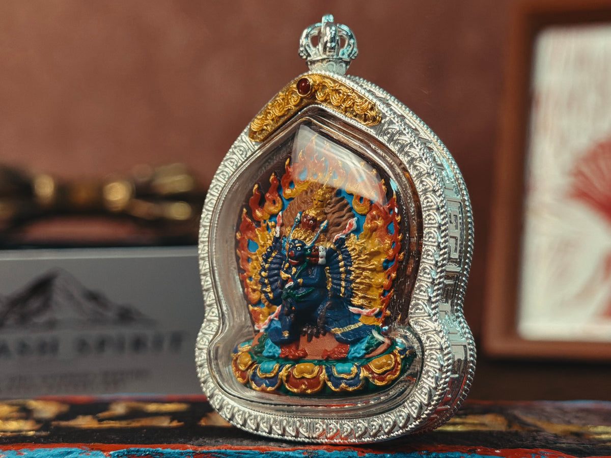Three-quarter view of Yamantaka pendant and hanging loop
